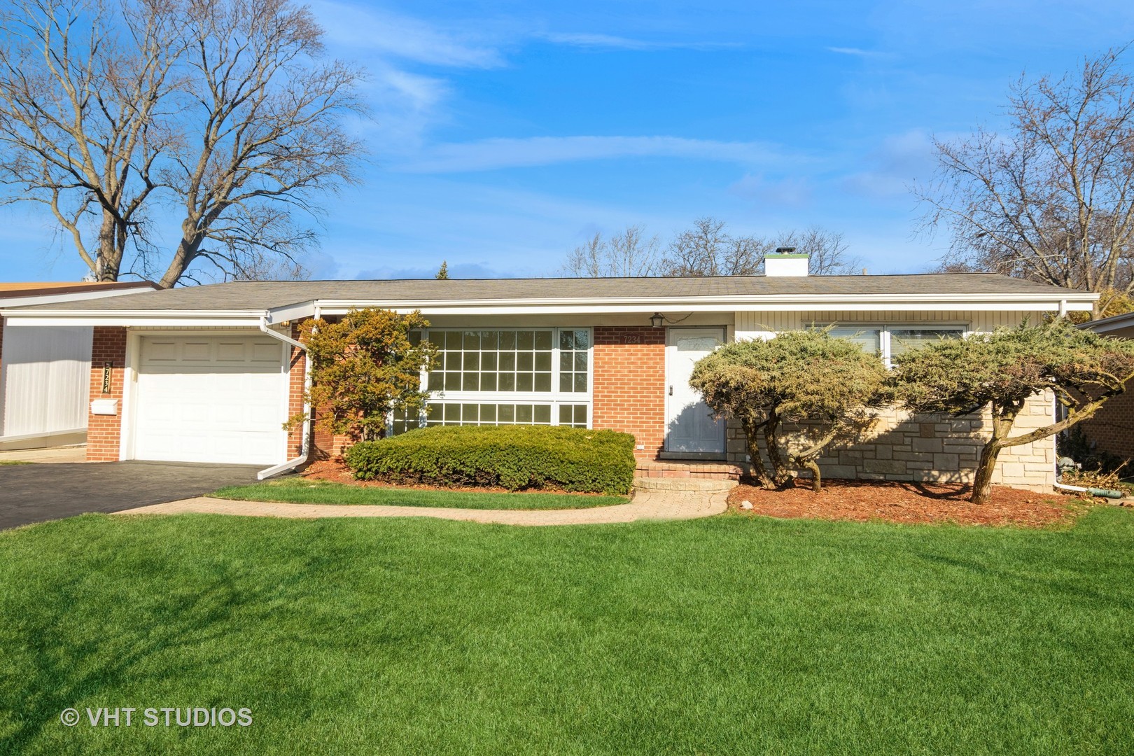 front view of a house with a big yard