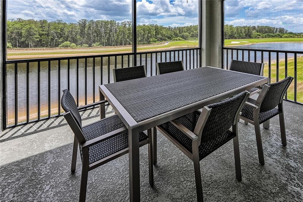 a view of a balcony with table and chairs