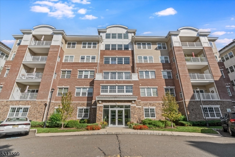 a front view of multi story residential apartment building