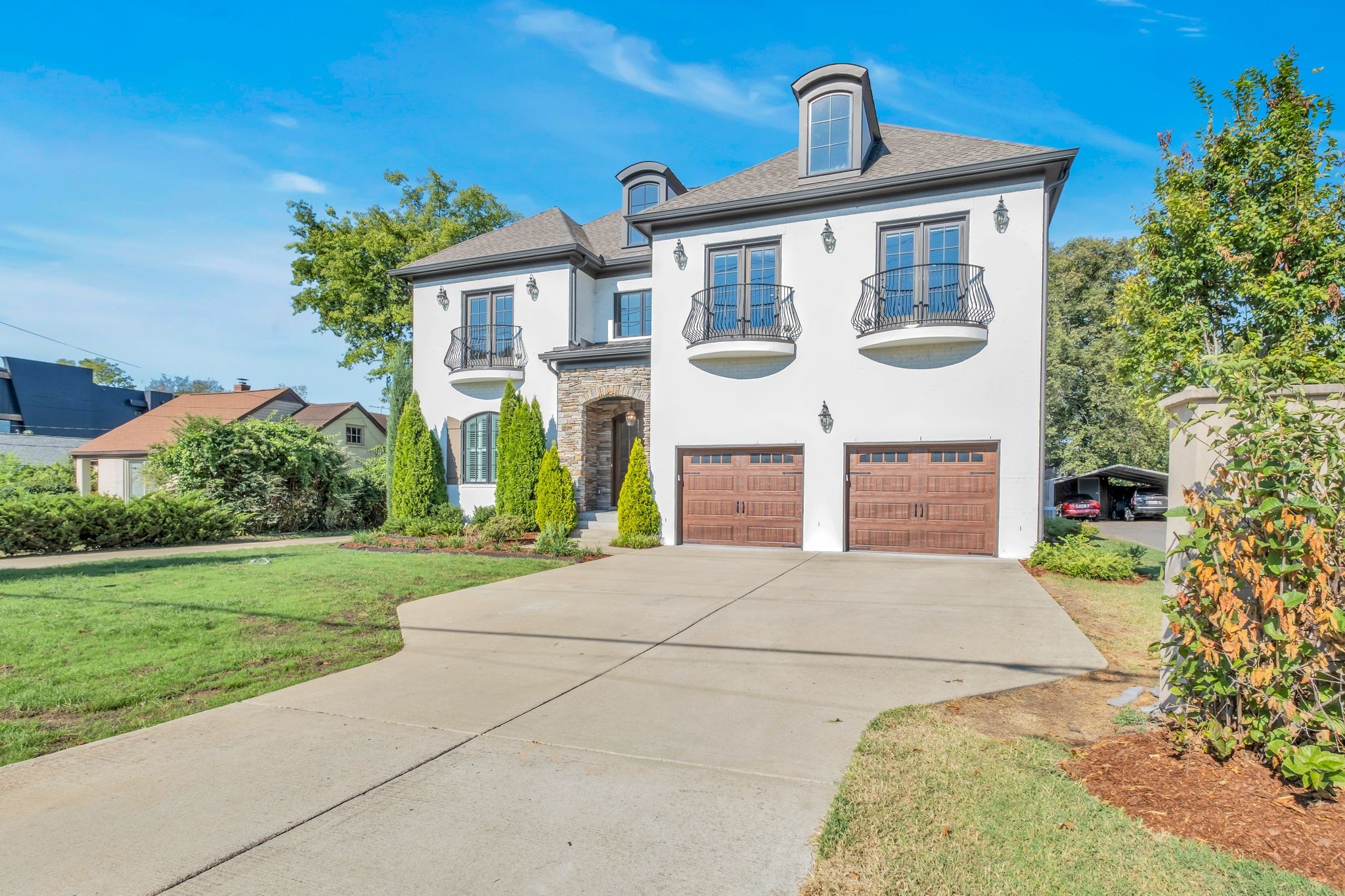 a front view of a house with a yard