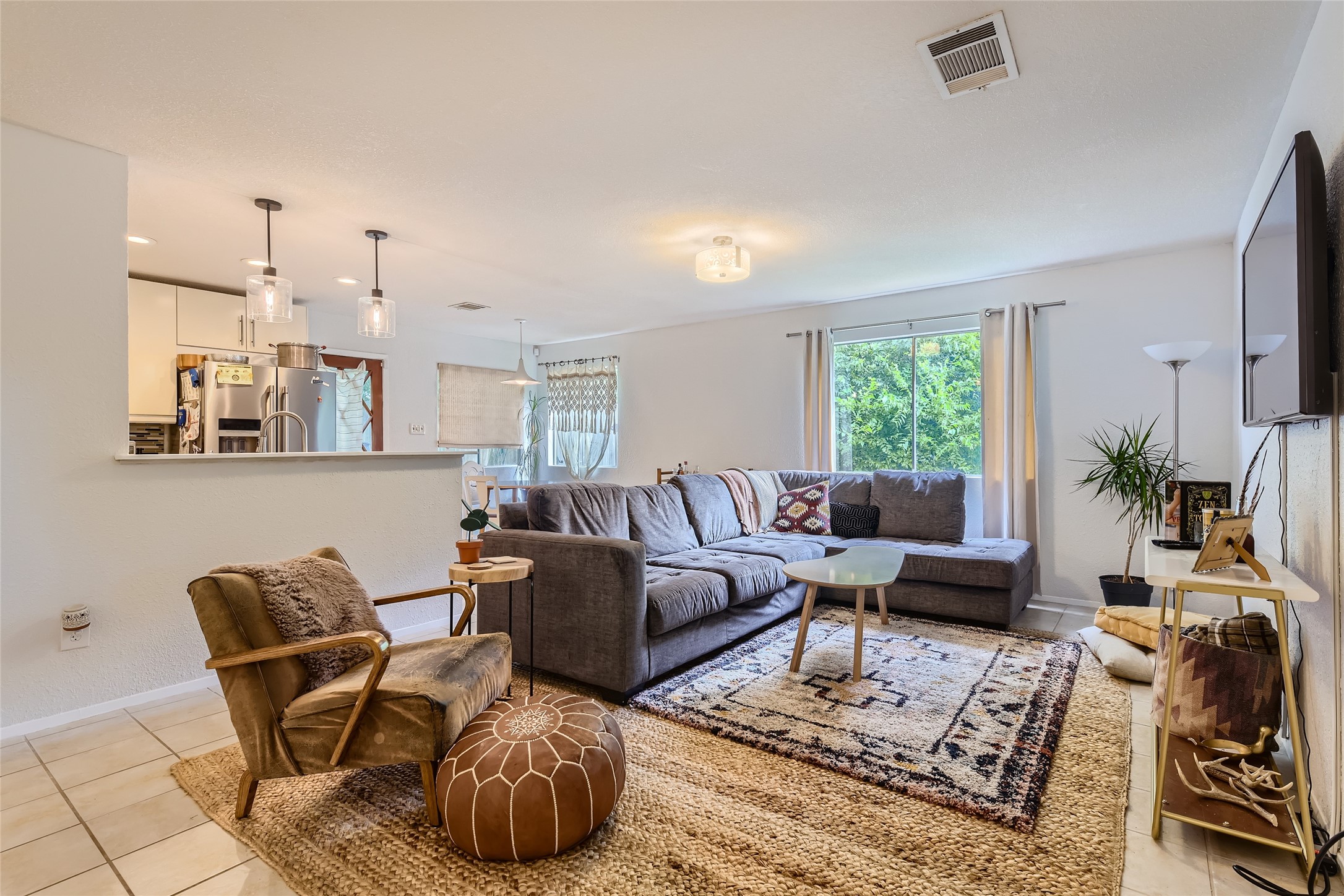 a living room with furniture and a large window