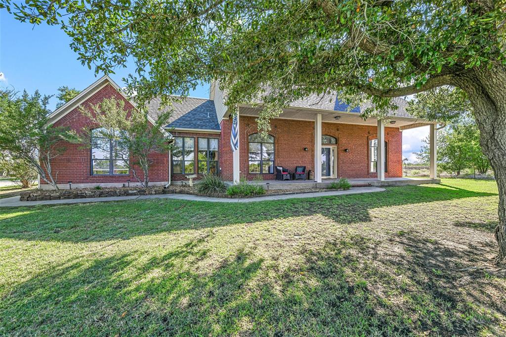 front view of a house with a yard