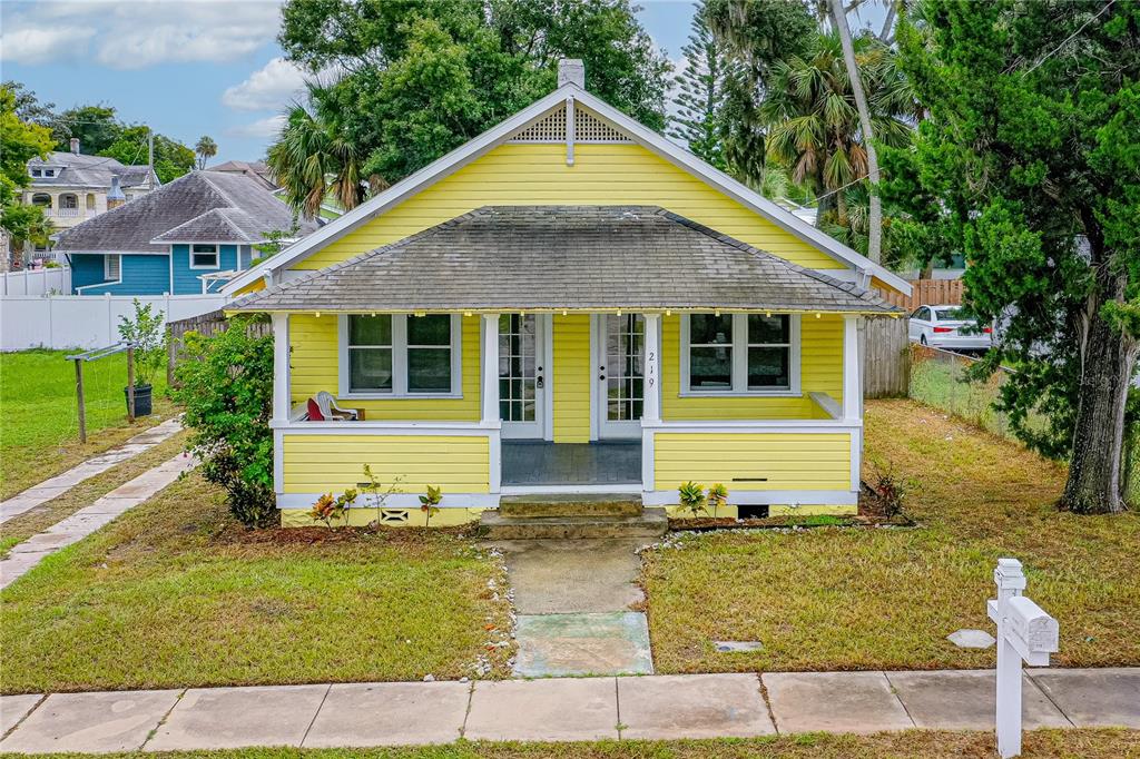 a view of front of house with a yard