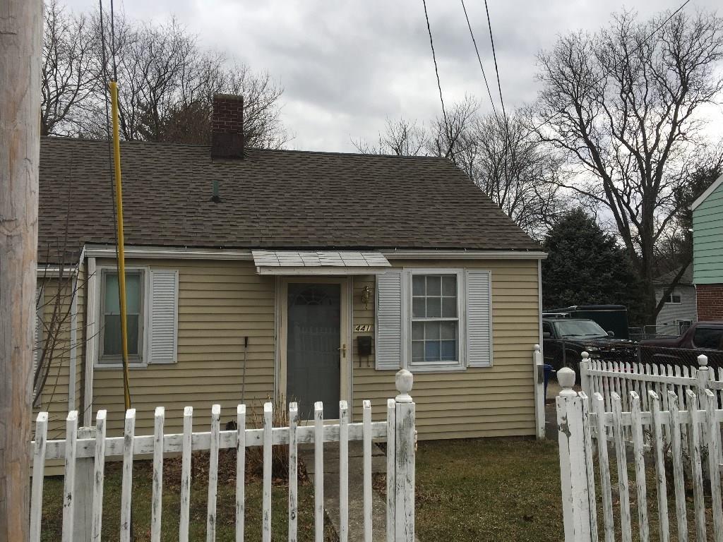 a view of a house with a iron gate