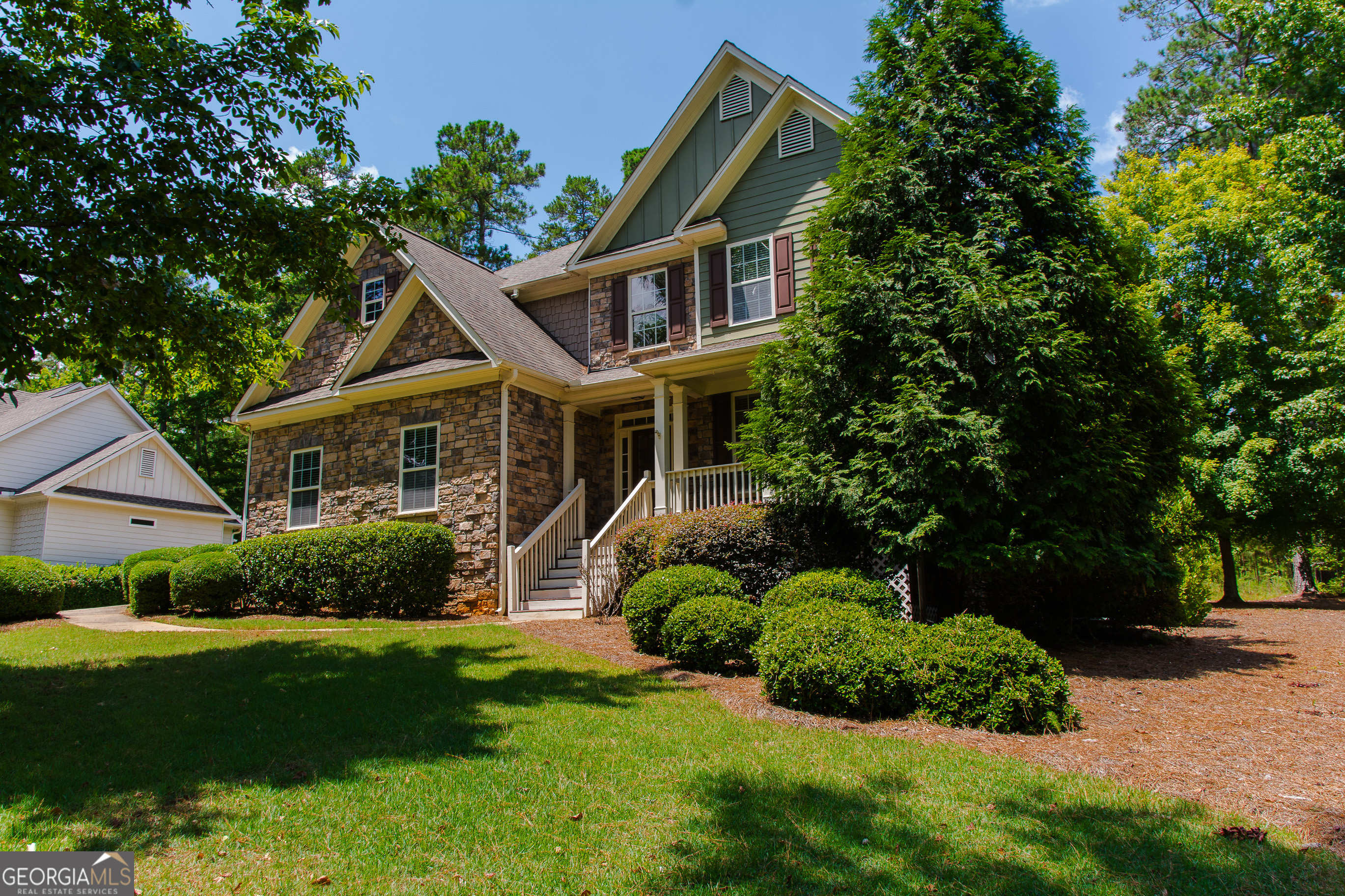 a front view of a house with a yard