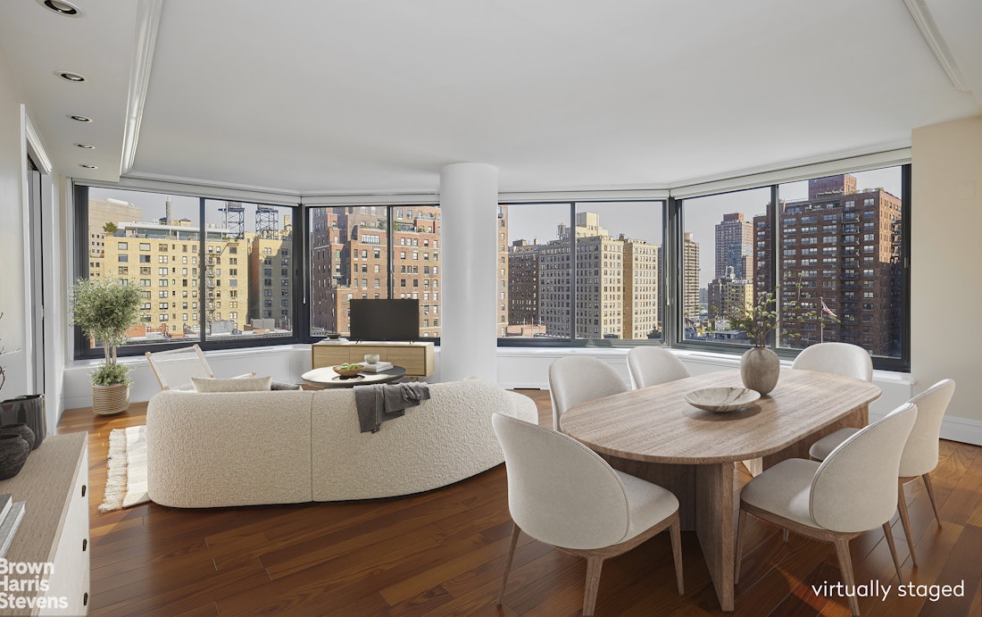 a dining room with furniture and wooden floor