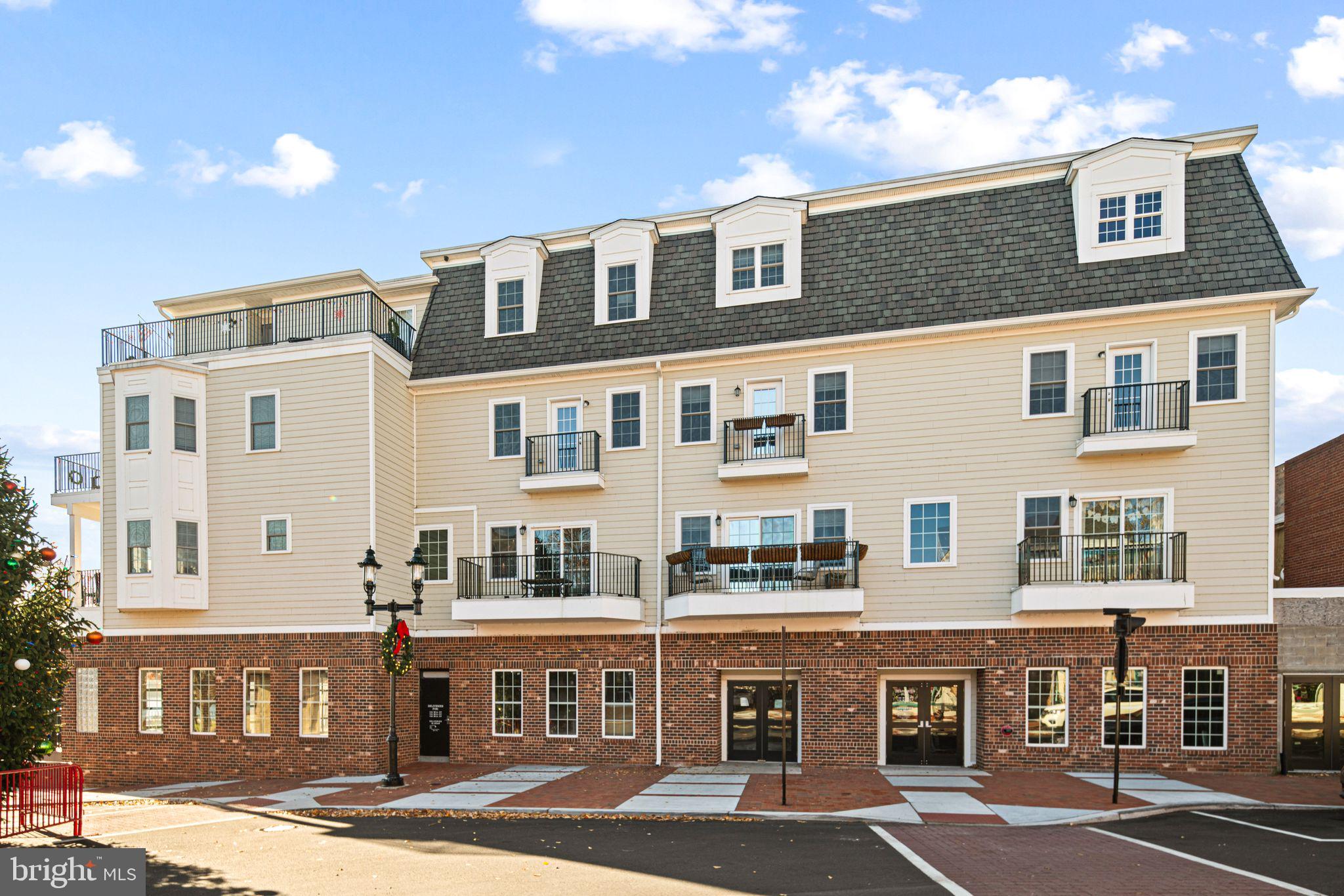 a front view of a building with parking space