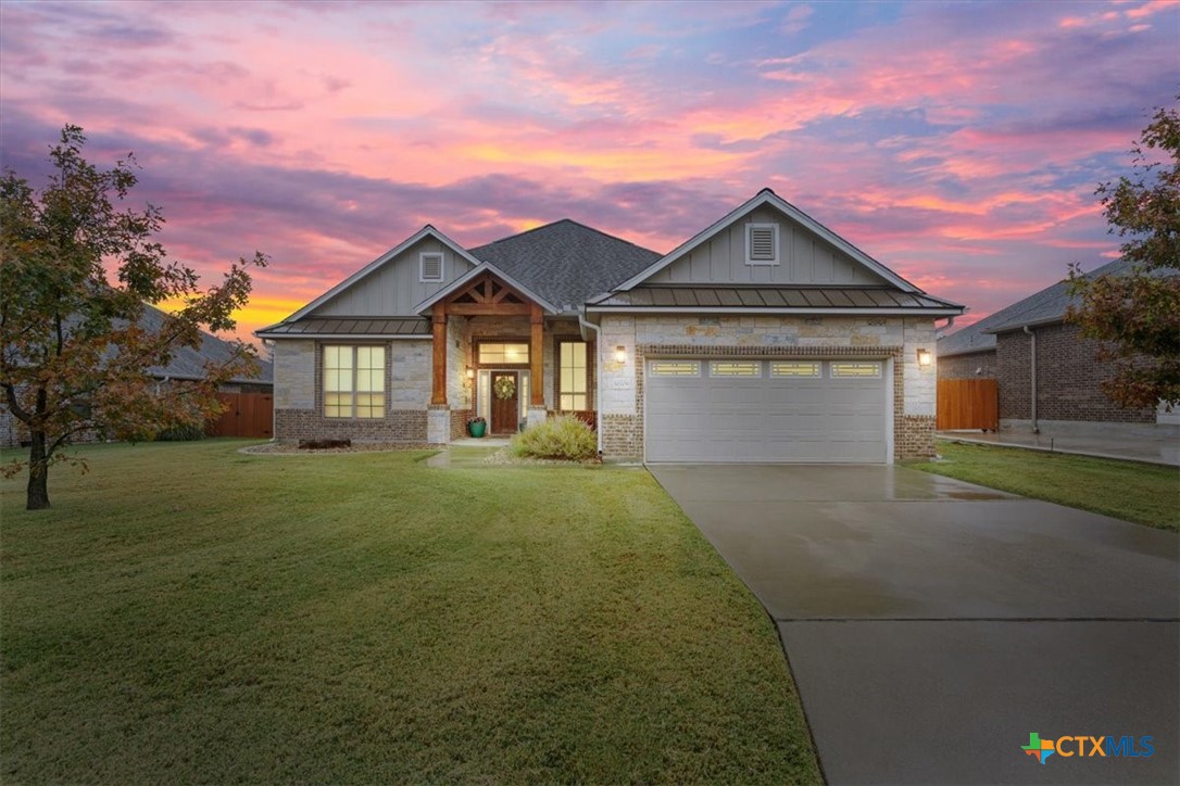 a front view of a house with yard