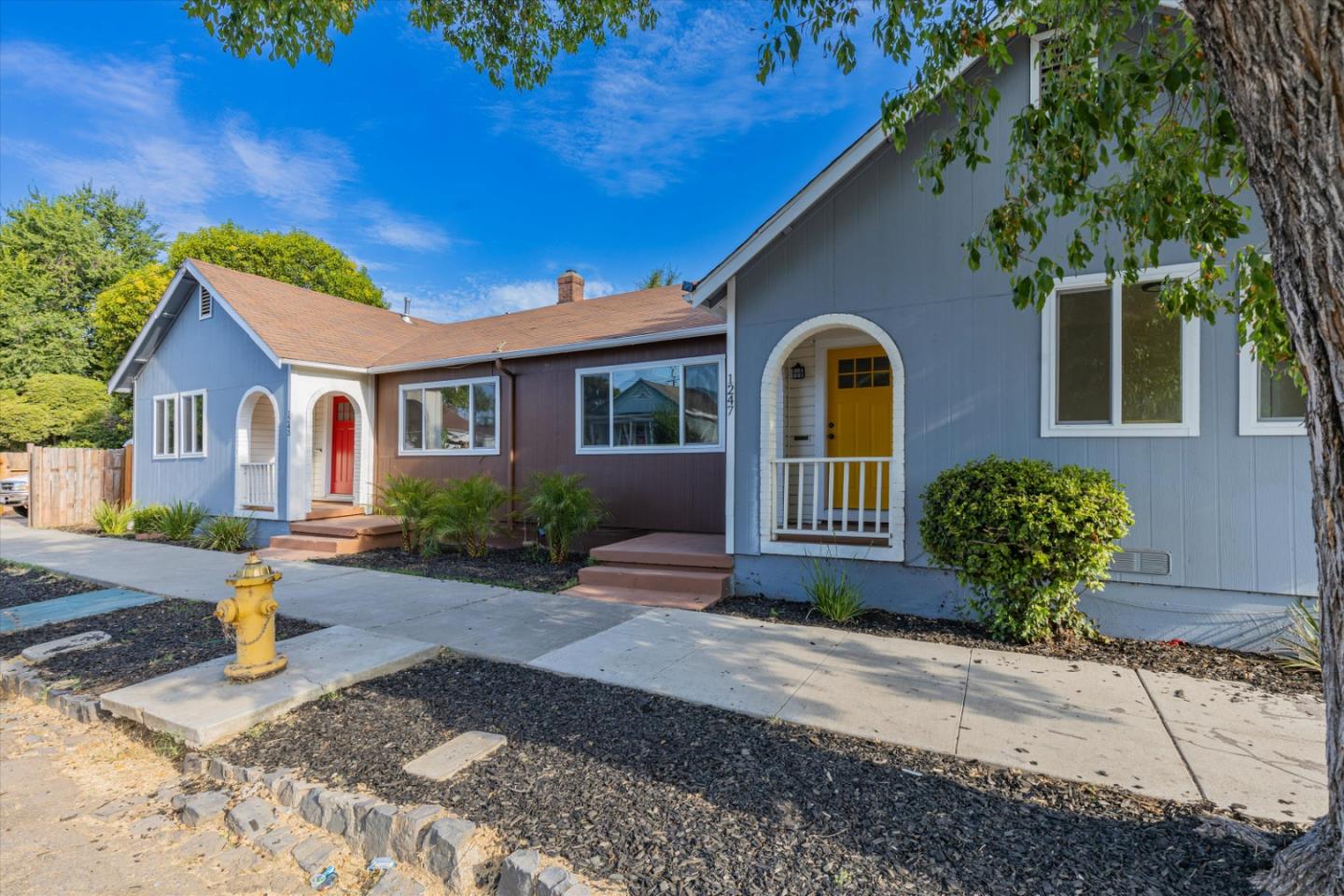 a front view of a house with garden