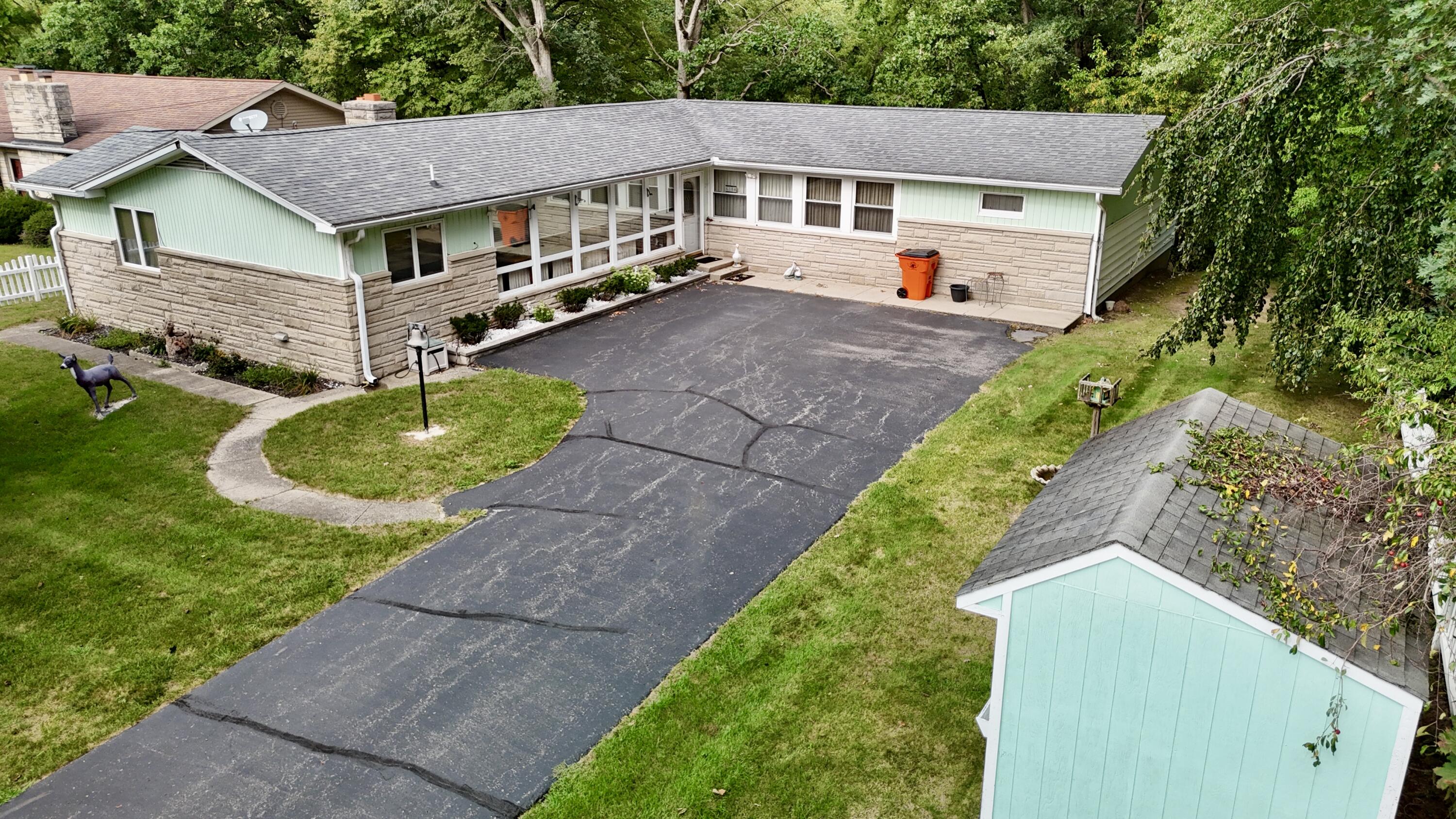 a aerial view of a house with a yard