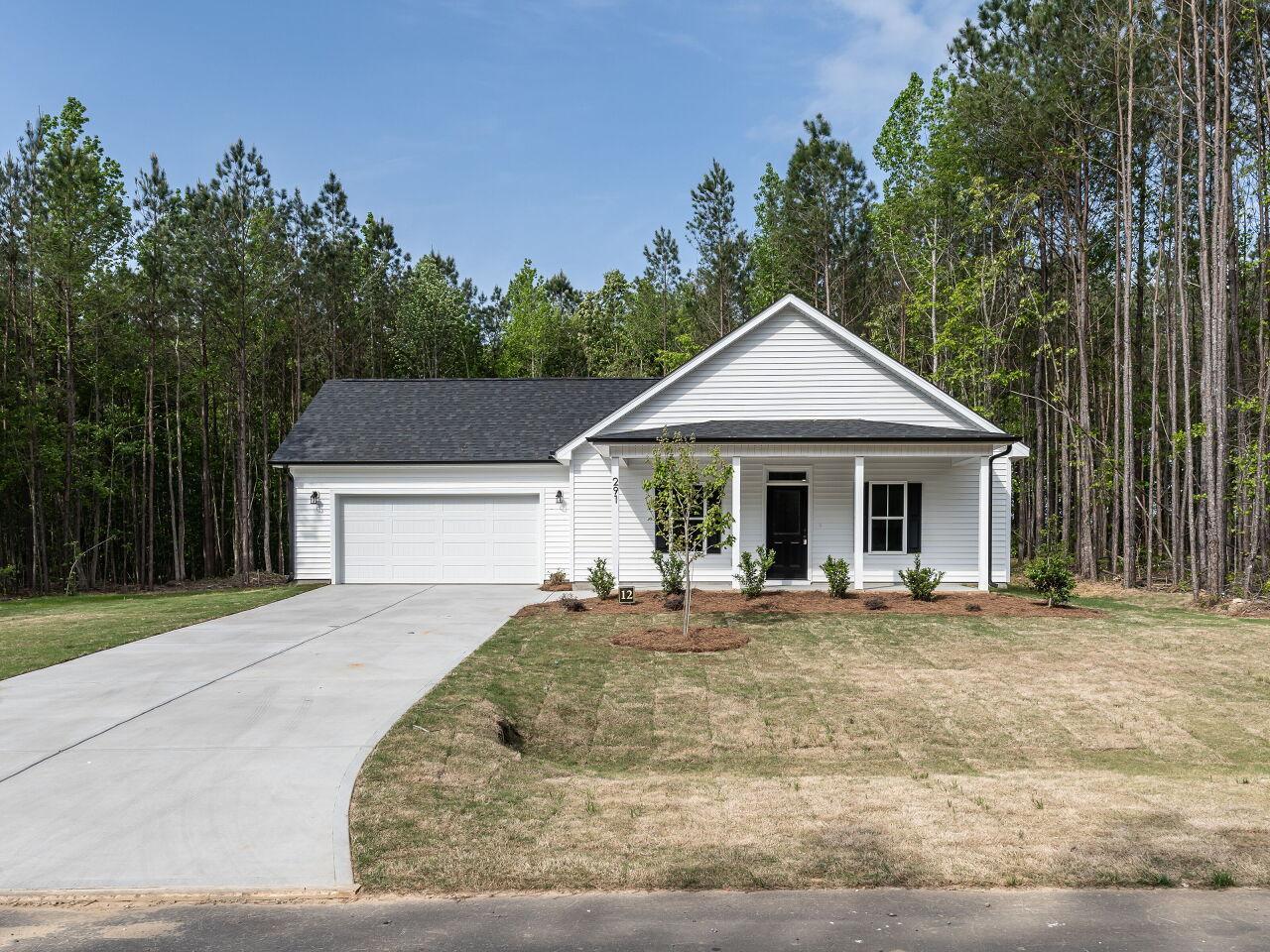 a front view of a house with yard