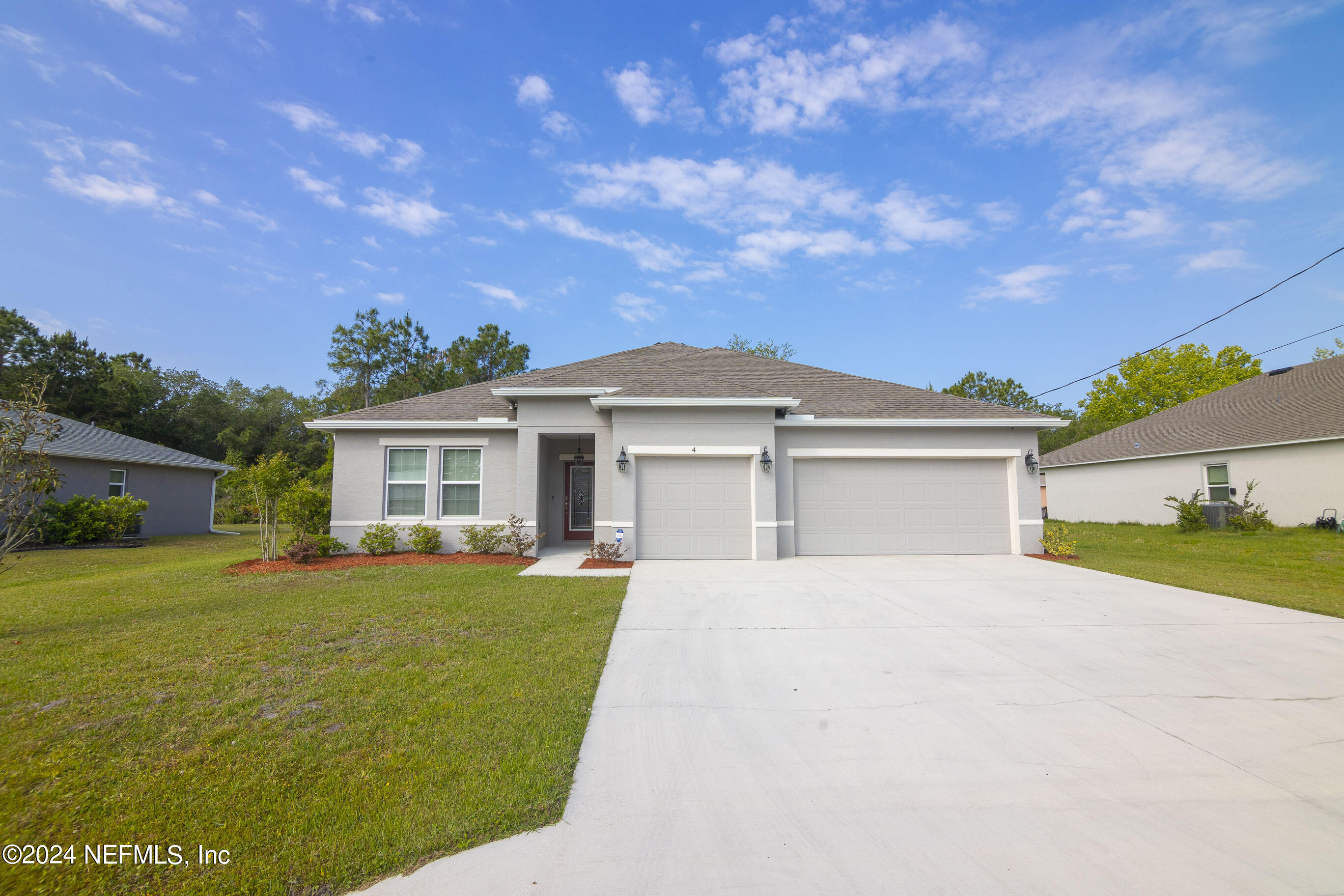 front view of a house with a big yard