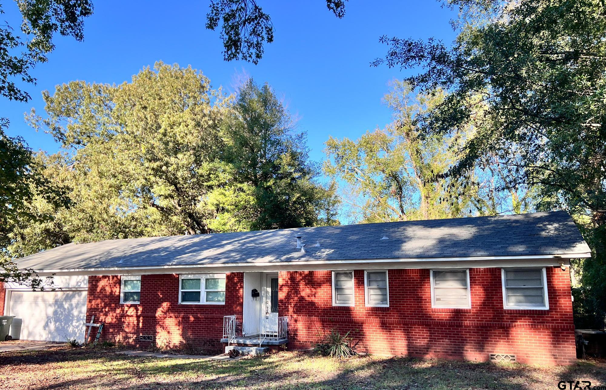 a view of house with outdoor space