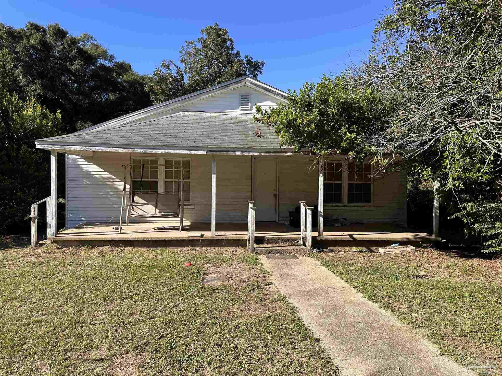 a house with yard in front of it