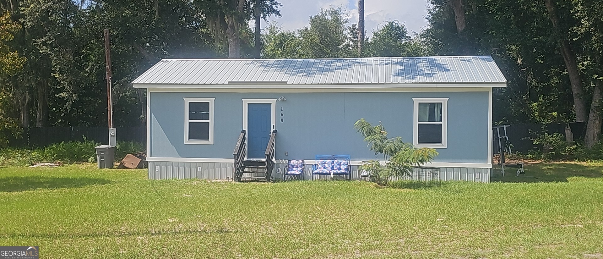 a view of a house with pool and garden