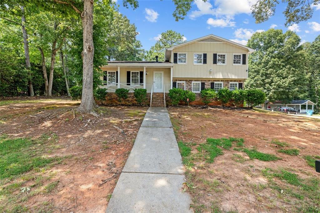 a front view of a house with yard