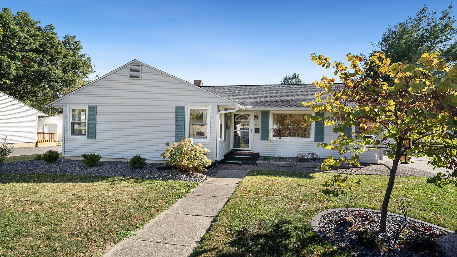 a front view of a house with a yard