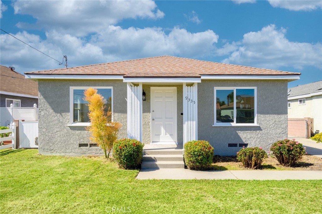 front view of a house with a yard