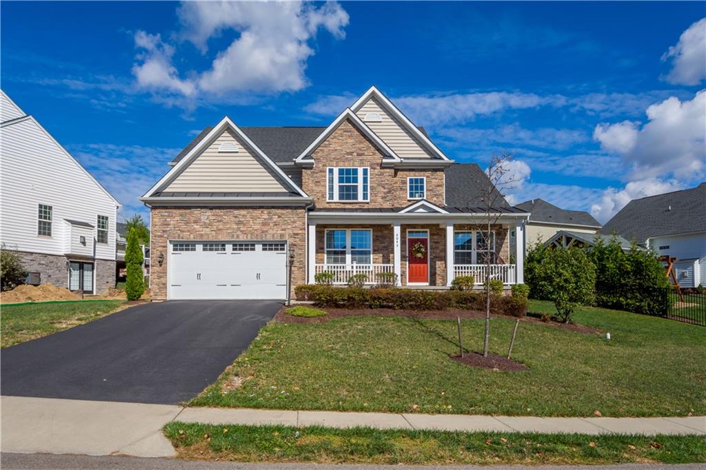 Stunning accented with timeless brick, adding warmth and character to the exterior.