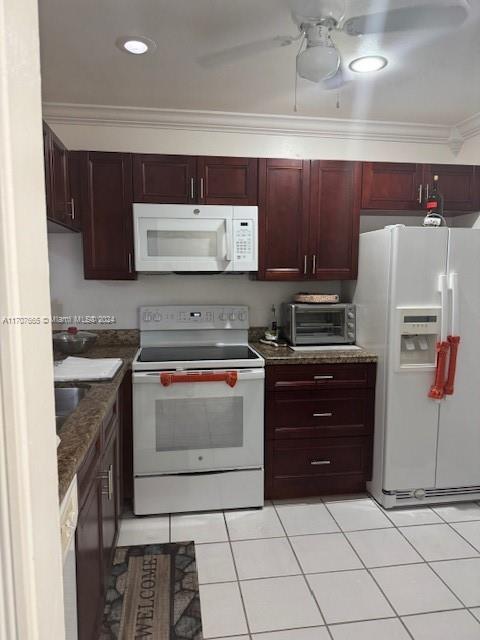 a kitchen with a stove and a refrigerator