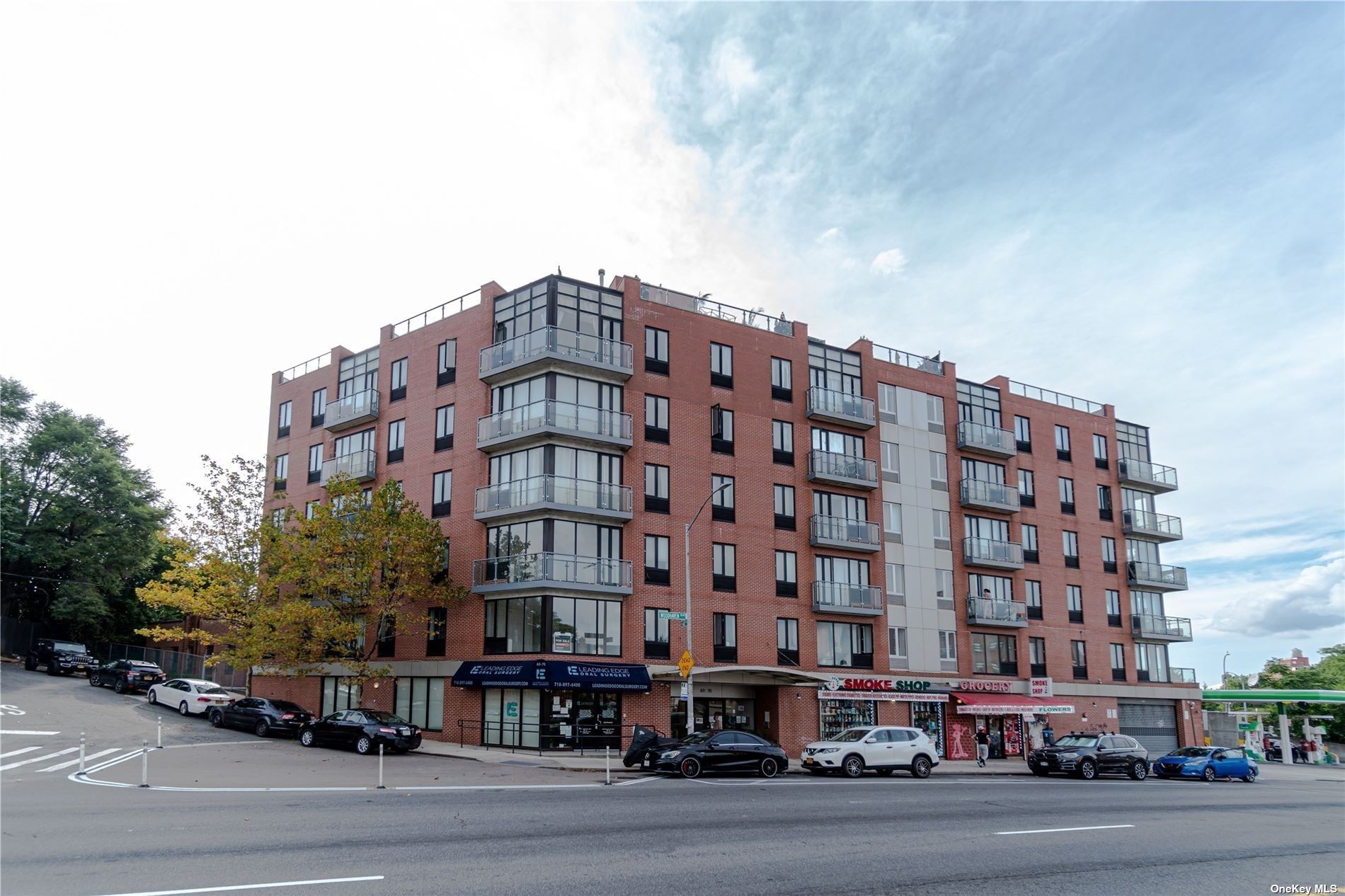 a large building with a street next to a road