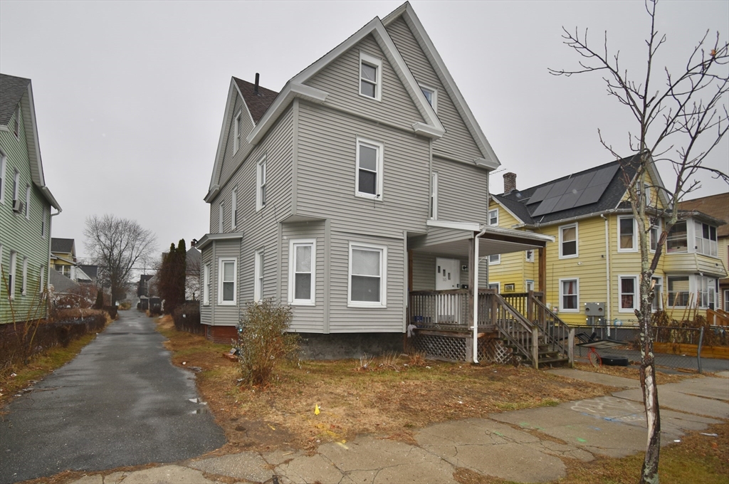 a view of a small yard in front of a house