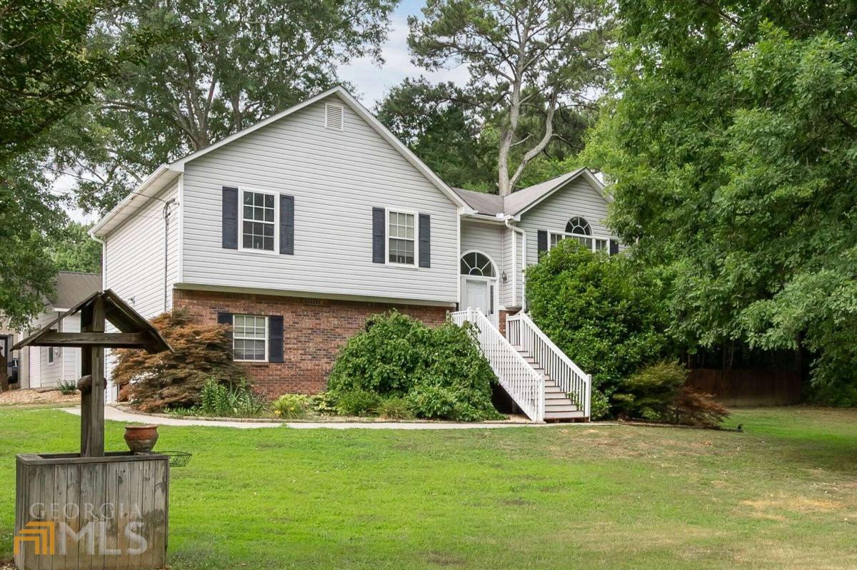 a front view of a house with a yard