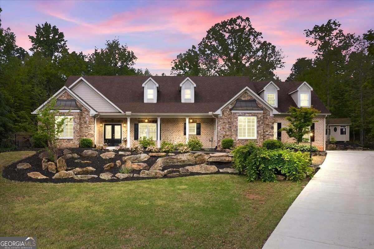 a front view of a house with garden