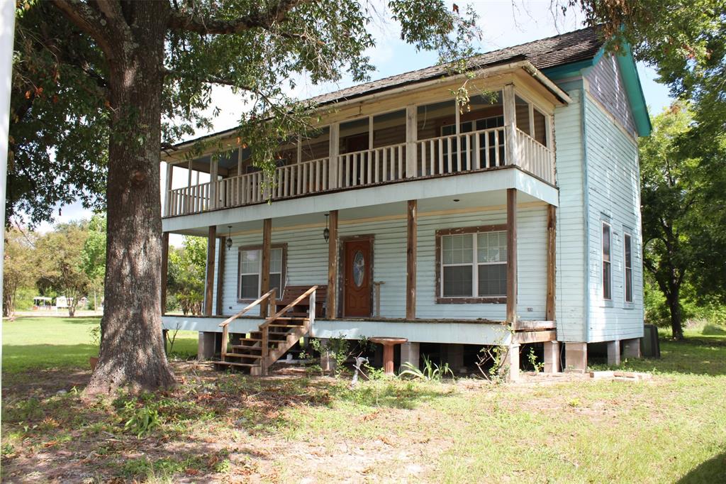 a front view of a house with a yard patio and fire pit