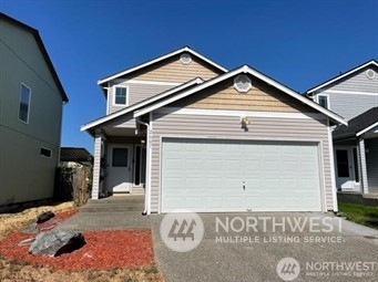 a view of a house with a garage