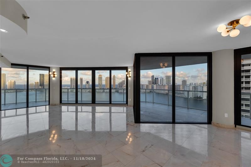 a view of an empty room with glass door