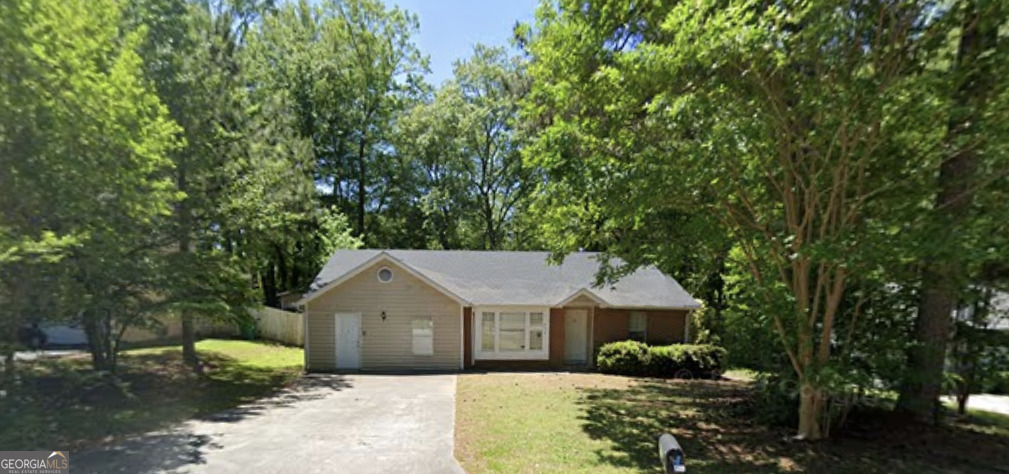 front view of a house with a yard