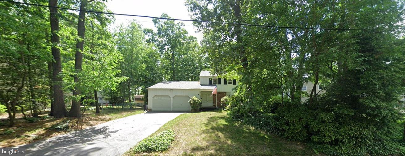 a utility room with dryer and trees