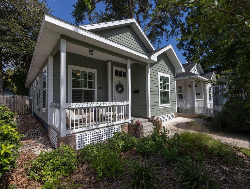 a front view of a house with garden