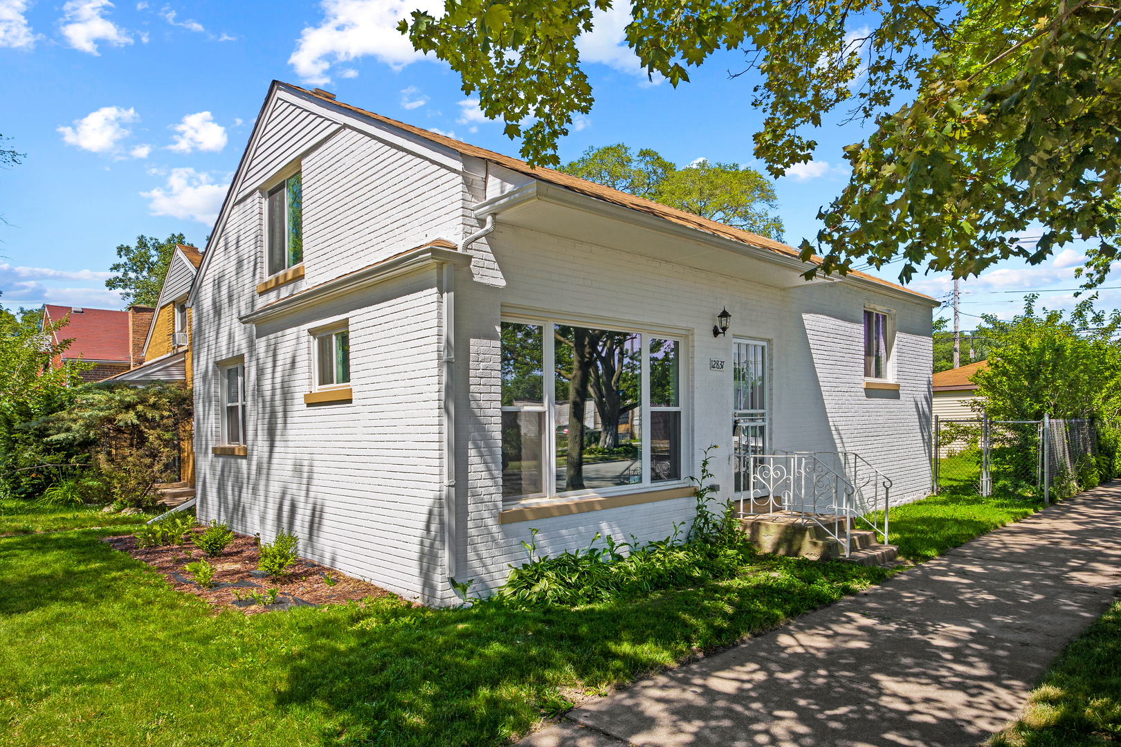 front view of a house with a yard