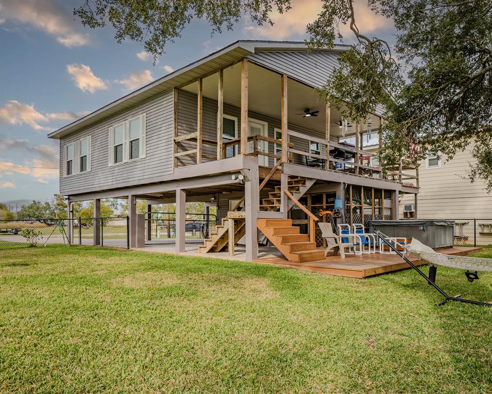 a view of a house with a yard patio and sitting area