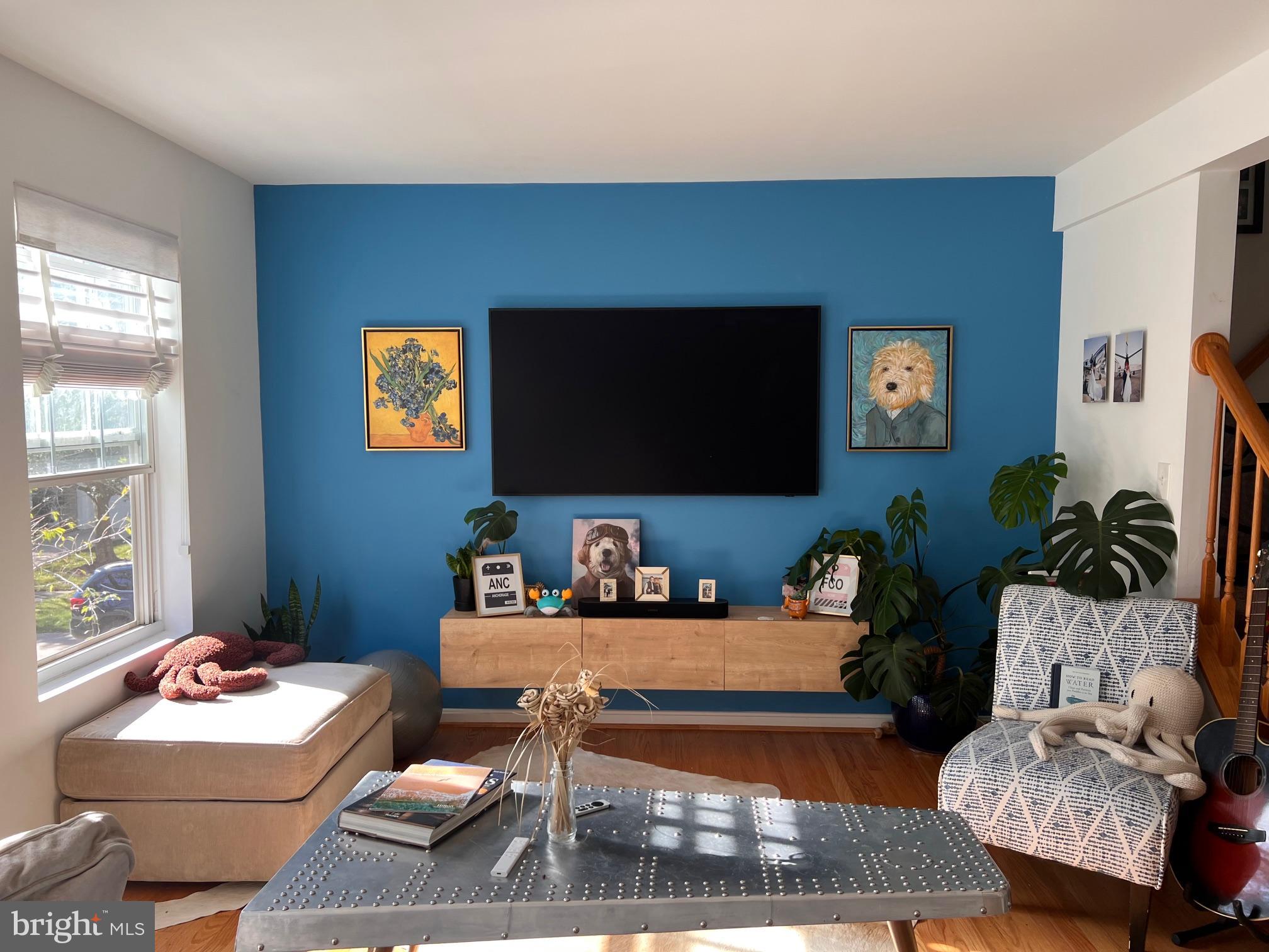 a living room with furniture and a flat screen tv