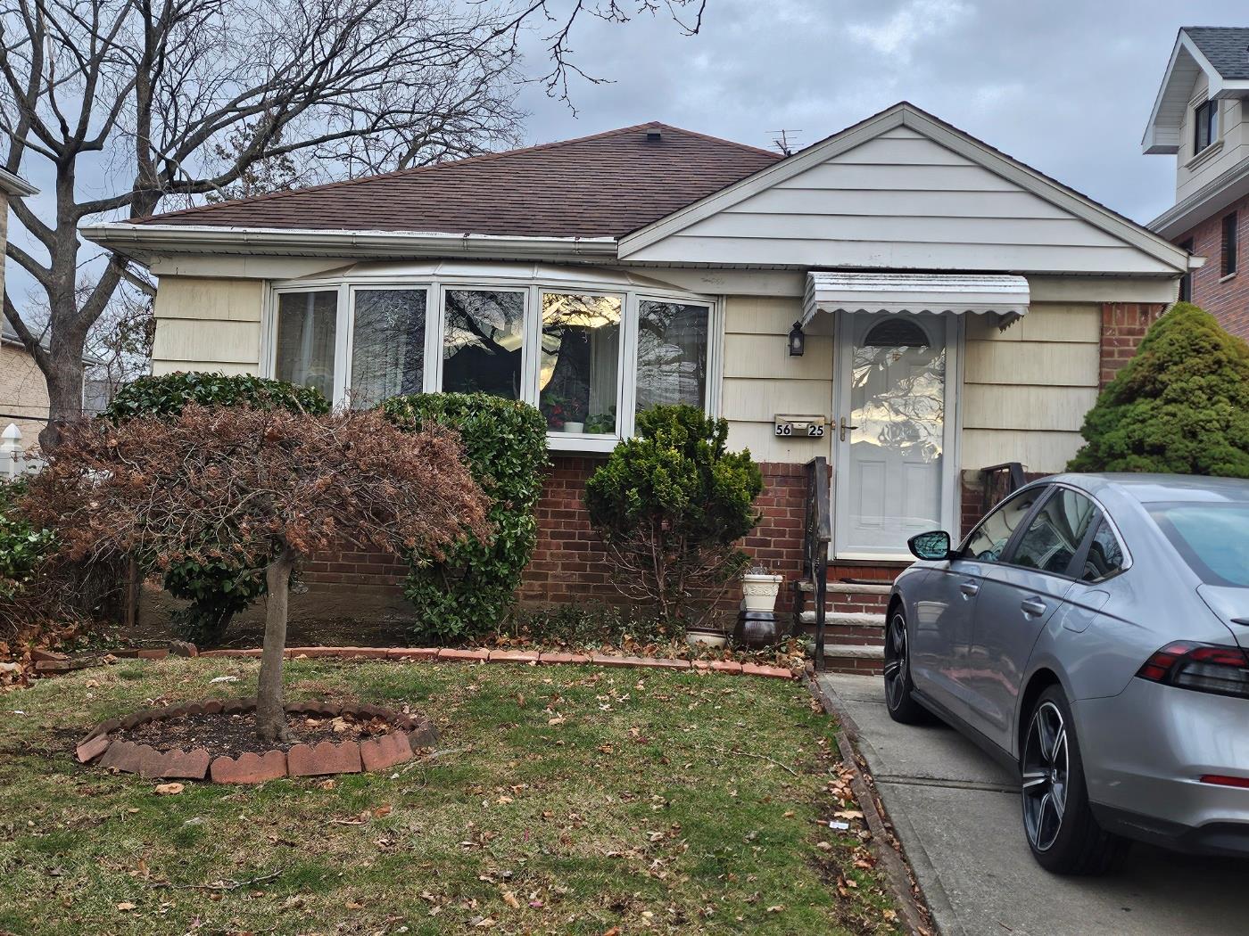 front view of a house with a yard