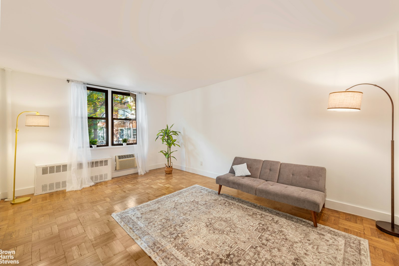 a living room with furniture and window