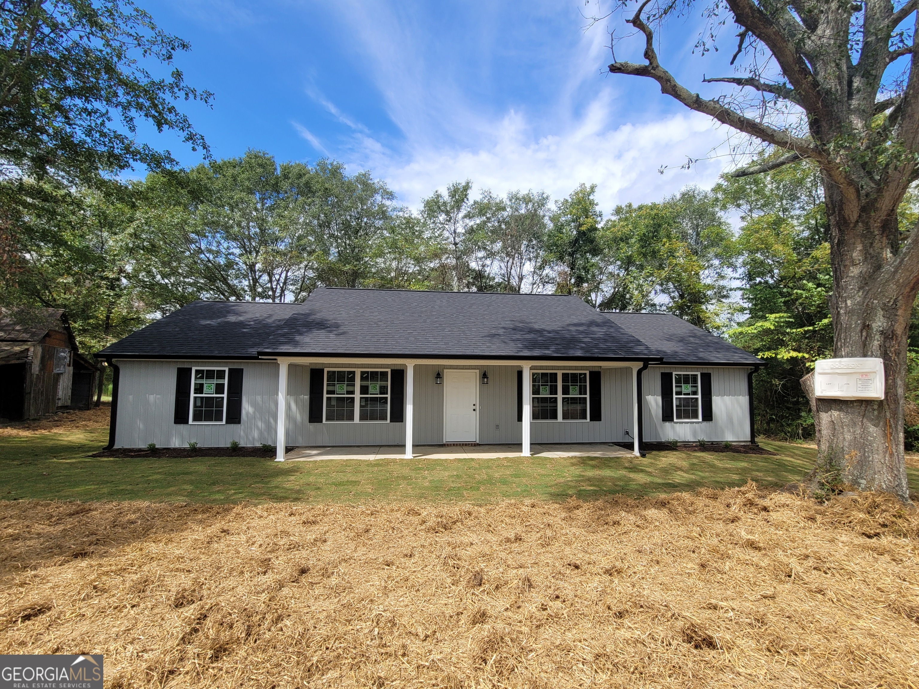 front view of a house with a yard