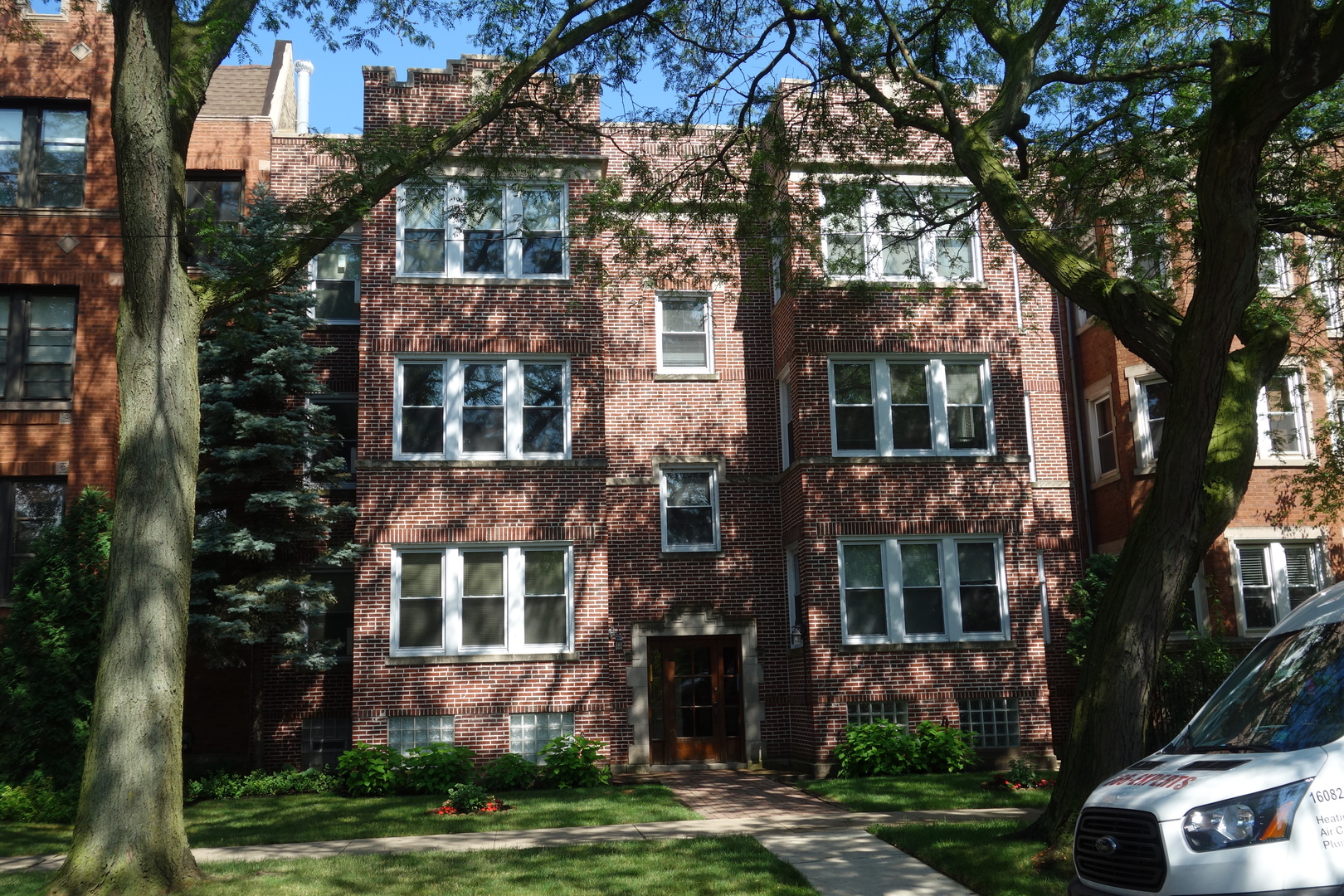 front view of building with a yard