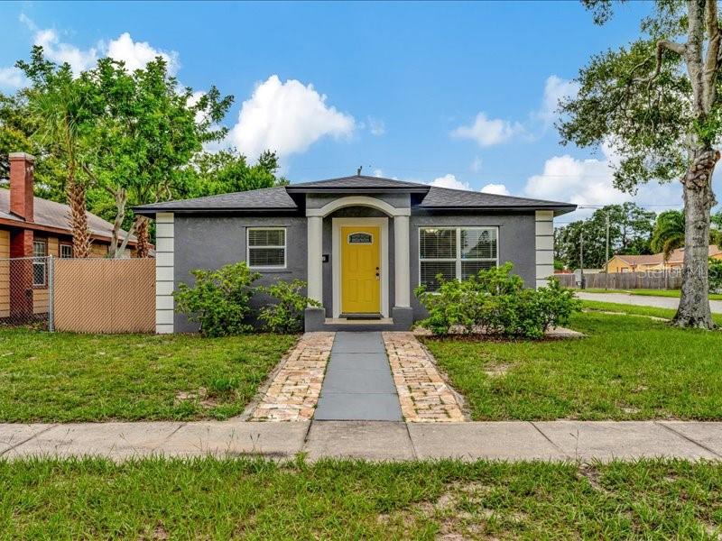 a front view of a house with a yard