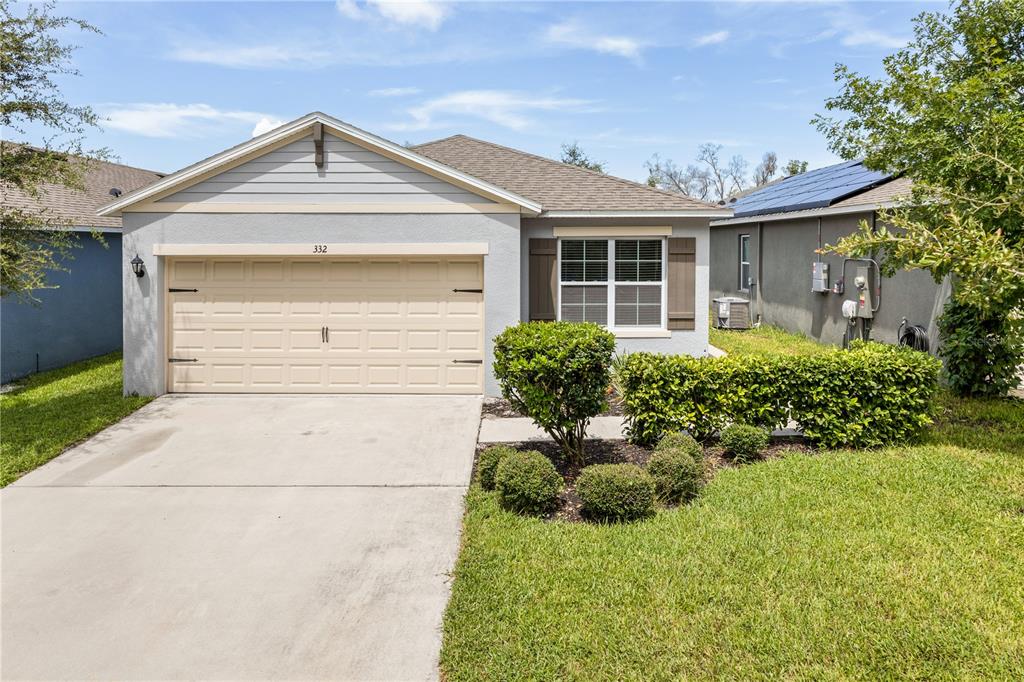 front view of a house with a yard