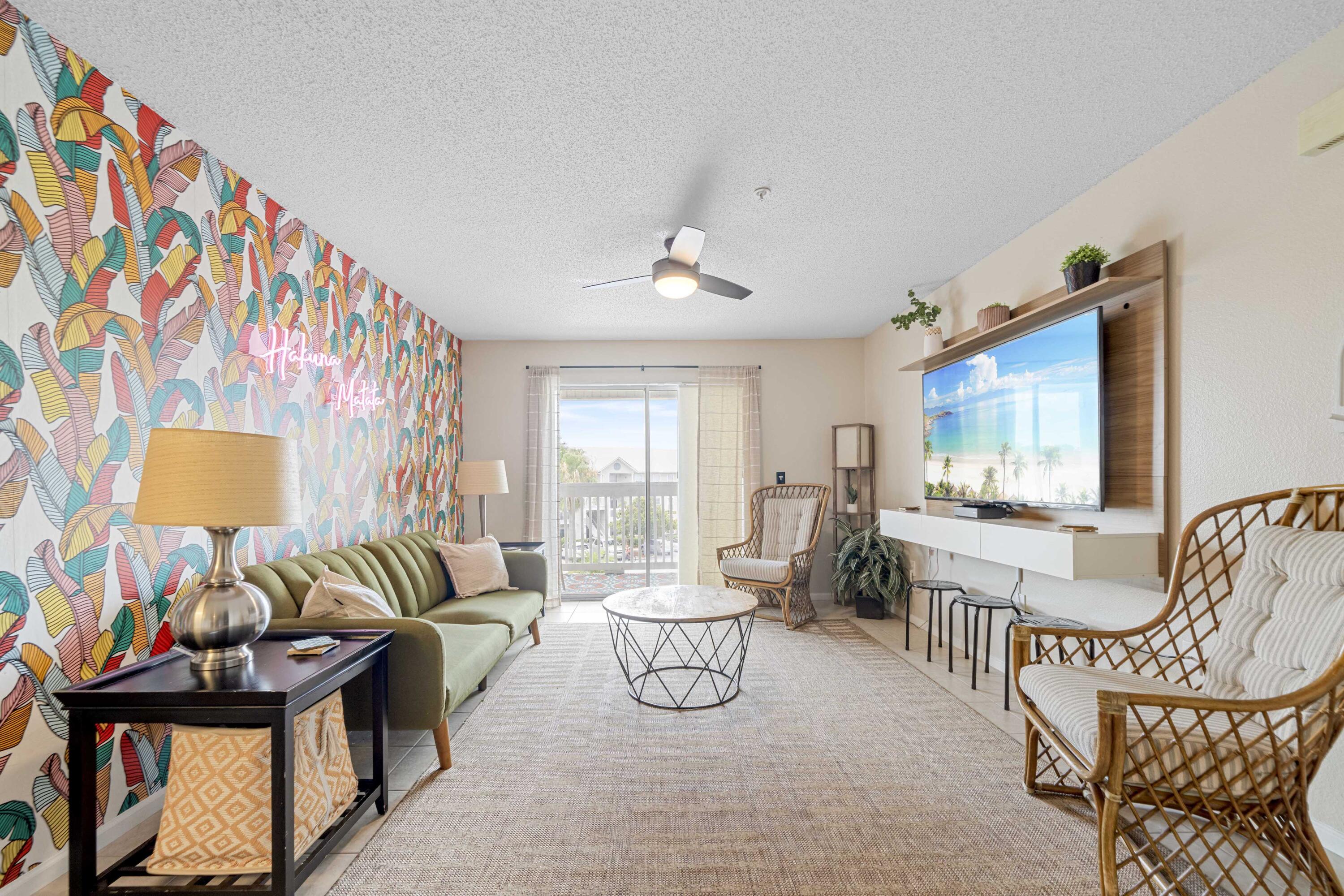 a living room with furniture and a flat screen tv