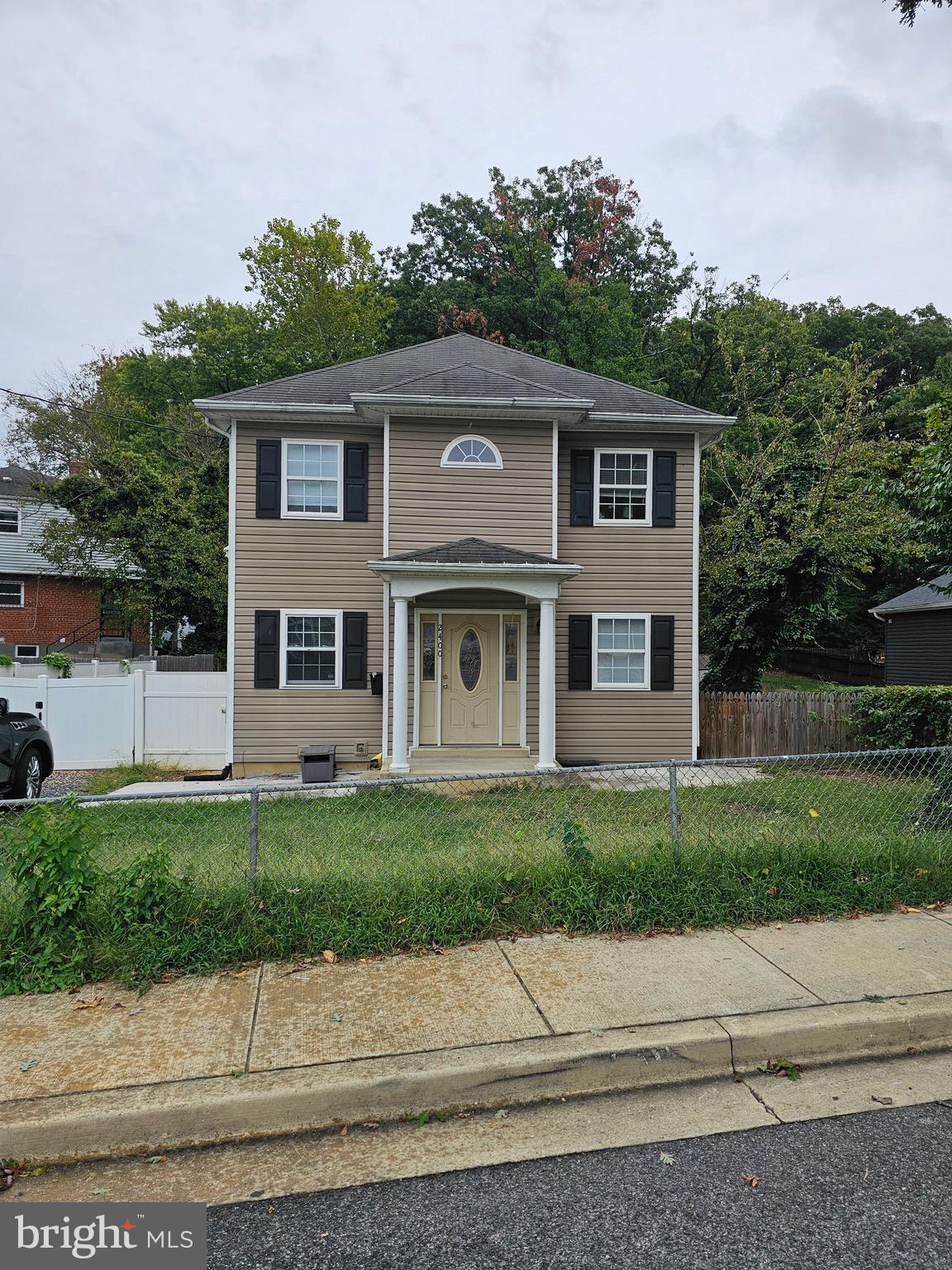 a view of a house with a yard