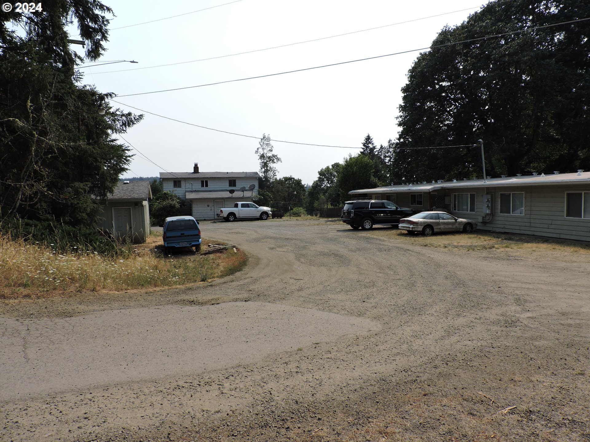 a view of street with parked cars