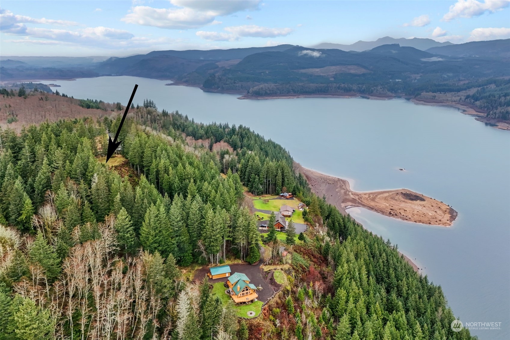 an aerial view of a house with mountain view