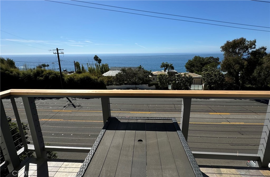 a view of balcony with wooden floor and city view