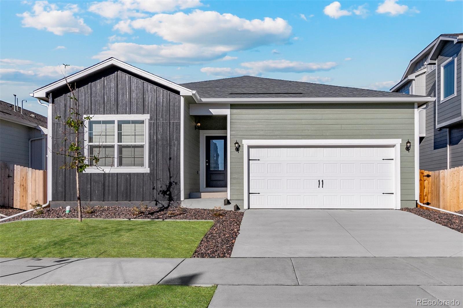 a view of a house with a yard