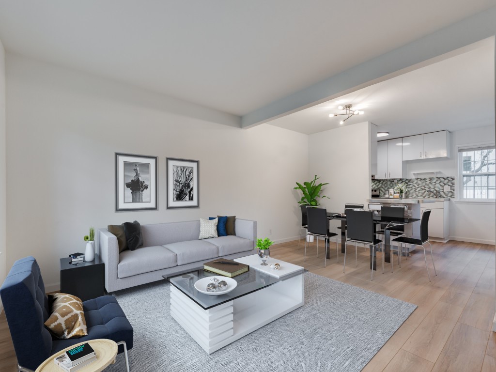 a living room with furniture and wooden floor